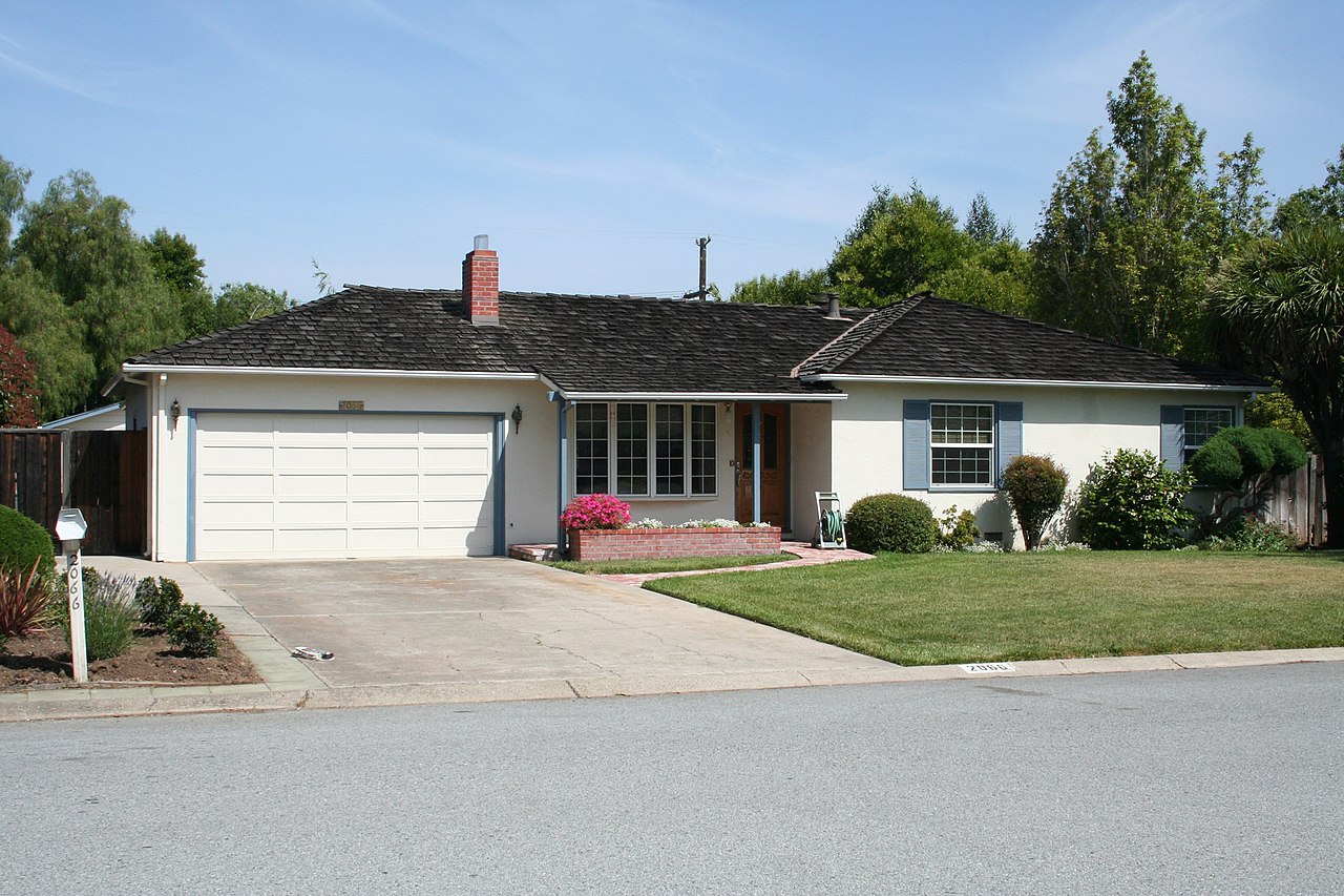 small white house with white garage doors where and When Was The First iPhone Ever