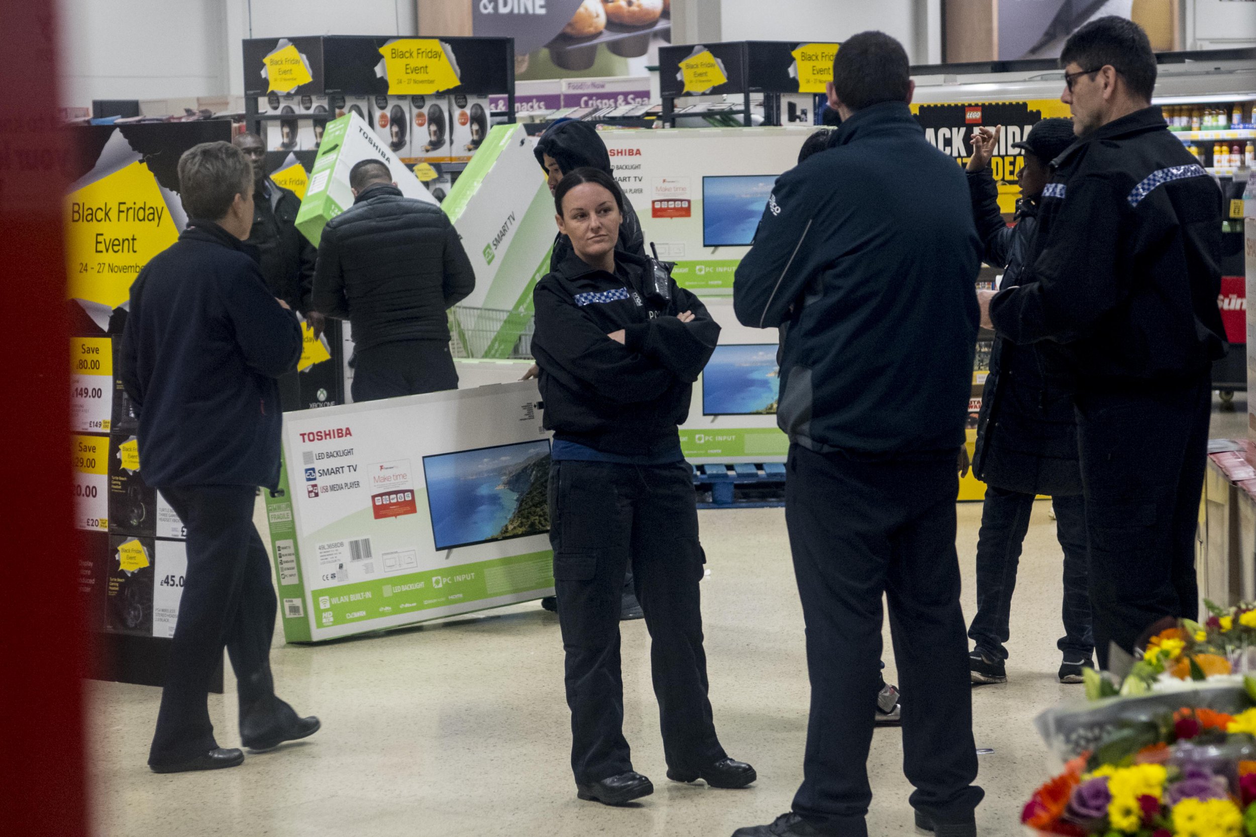 Black Friday deals, people queuing up for end of November shopping spree.